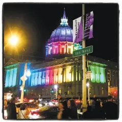  ?? Catherine Bigelow / Special to The Chronicle ?? City Hall was illuminate­d in rainbow hues for the SF Symphony Pride concert on April 4 to benefit LGBTQ causes.