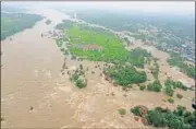  ??  ?? An aerial view of flood-hit Edupalaya village in Medak district of Telangana on Sunday. PTI PHOTO