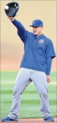  ?? AP PHOTO ?? Chicago Cubs’ Anthony Rizzo makes a catch during baseball practice at Nationals Park on Thursday in Washington.