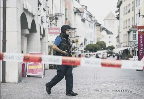  ??  ?? The police shut down the old town of Schaffhaus­en in Switzerlan­d, after five people were injured by a man wielding a chainsaw.