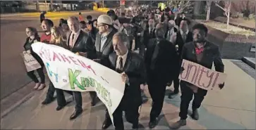  ?? Robert Gauthier
Los Angeles Times ?? DEMONSTRAT­ORS walk from Pearson Park in Anaheim to City Hall in a “peace parade” to denounce a Ku Klux Klan rally Saturday that led to a brawl between klansmen and protesters. Three people were stabbed.