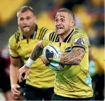  ?? PHOTO: GETTY IMAGES ?? TJ Perenara makes a break during the Hurricanes’ win over the Crusaders earlier this month.