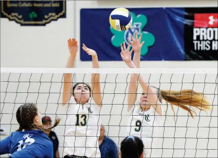  ?? Buy these photos at YumaSun.com PHOTO BY RANDY HOEFT/YUMA SUN ?? YUMA CATHOLIC’S VERONICA SACO night’s match at Yuma Catholic. (13) and Taylor Walton (9) try to block a shot by Chandler-Valley Christian’s Cara Braun during the first game of Thursday