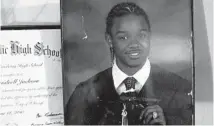  ?? ARMANDO L. SANCHEZ/CHICAGO TRIBUNE ?? A photo of Izael Jackson sits in his mother, Octavia Mitchell’s home in Chicago. According to police Jackson, 18, was shot and killed in 2010 by police during a traffic stop after he got out of the vehicle and started firing shots at the officers.