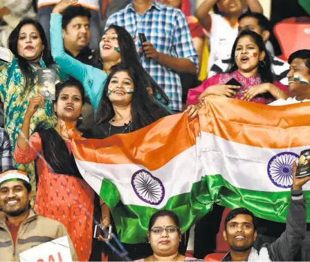  ?? GETTY IMAGES ?? Cheering on: The minimal presence and interferen­ce from police made the World Cup an enjoyable experience for the spectators.