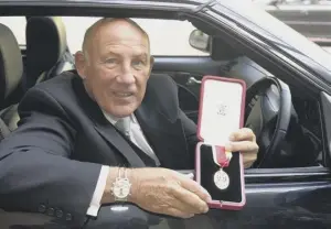  ??  ?? 2 Sir Stirling Moss gets back behind the wheel after receiving his knightood in 1999