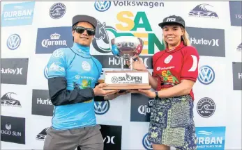  ??  ?? AND THE WINNERS ARE: Mateus Herdy of Brazil and Hawaiian Zoe McDougall claimed the junior men’s and women’s titles at the Volkswagen SA Open of Surfing in Durban yesterday.