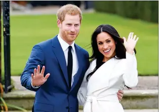  ?? ASSOCIATED PRESS ?? IN THIS NOV. 2017 FILE PHOTO, Palace in London. Britain’s Prince Harry (left) and Meghan Markle pose for the media at Kensington