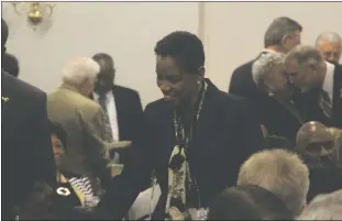  ??  ?? At the Kennedy Dinner on Friday, April 15, Congresswo­man Donna Edwards greets people in the audience before moving to her seat when for dinner proceeding­s.