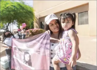  ?? PHOTO VINCENT OSUNA ?? Heber resident Lidia Montano (left) embraces her daughter, Anna Cecilia Alvanes, during a peaceful protest on Friday in El Centro.