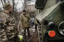  ?? LYNSEY ADDARIO — THE NEW YORK TIMES ?? Ukrainian soldiers who recently pulled out of Avdiivka, Ukraine, replenish supplies in a nearby village in February. The U.S. has promised to send more aid to the region.