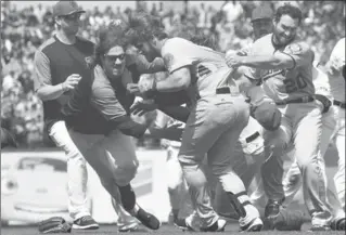  ?? THEARON W. HENDERSON, GETTY IMAGES ?? Jeff Samardzija of the San Francisco Giants goes after Bryce Harper of the Washington Nationals. Harper charged the mound after being hit by a pitch from Hunter Strickland, triggering a brawl Monday.