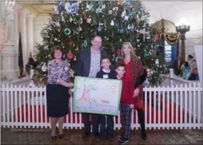  ?? SUBMITTED PHOTO ?? Roman Guagnozzi, his parents and his teacher, Mrs. Fox, were invited to Harrisburg for a luncheon as a winner of the 2019 PA Attorney General’s Drug-Free Calendar.
