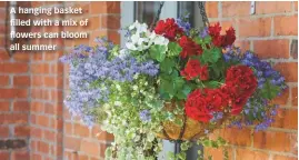  ??  ?? A hanging basket filled with a mix of flowers can bloom all summer