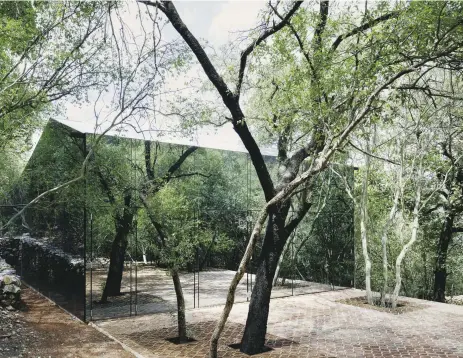  ??  ?? Los Terrenos, a holiday home in Mexico, blends seamlessly with the surroundin­g forest due to its mirrored glass façade.