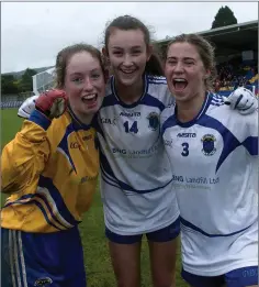  ??  ?? Zoe Byrne, Niamh Caffrey and Medhbh O’ Keane celebrate after the final whistle in Joule Park Aughrim.