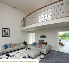  ??  ?? A balcony overlooks the open-plan living space