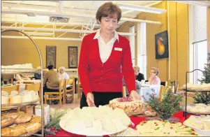  ?? MILLICENT MCKAY/JOURNAL PIONEER ?? Delores Griffin, one of the guest chefs the students at KRHS worked with to create desserts for a Christmas Tea, puts out the final tray.