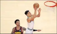  ?? Kevin C. Cox
/
Getty Images ?? The Nuggets’ Michael Porter Jr. goes to the basket against the Hawks on Feb. 21 at State Farm Arena in Atlanta.