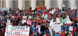  ?? ALEX FLYNN / NEW YORK TIMES ?? Protesters support higher teacher pay Feb. 27 in Charleston, W.Va. Fiscal austerity has cut deeply into public education in conservati­ve states.