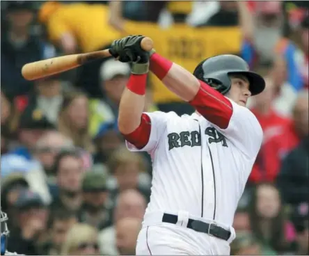  ?? ELISE AMENDOLA — THE ASSOCIATED PRESS ?? Boston Red Sox’s Andrew Benintendi hits a three-run home run in the fourth inning of a baseball game against the Toronto Blue Jays at Fenway Park, Monday in Boston.