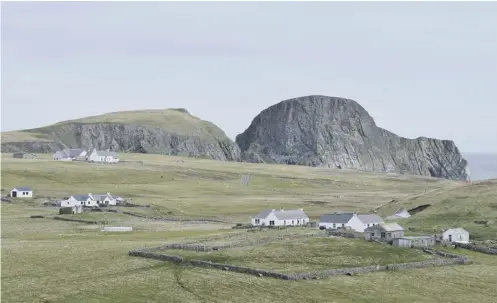  ??  ?? 0 Fair Isle is receiving round-the-clock, renewable electricit­y from three wind turbines, an array of solar panels and battery storage