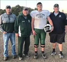  ?? Photo submitted ?? Mitch Miles is a 6-foot-3½, 295-pound junior lineman at Laurel. Three of his coaches are, from left: Casey Miles, his uncle; George Miles, his grandfathe­r; and Ryan Miles, his father.