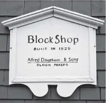  ?? Josh Healey ?? A plaque commemorat­es the old Block Shop, now home to Lexicon books, which was built in 1925 and helped to serve Lunenburg’s fishing fleet.