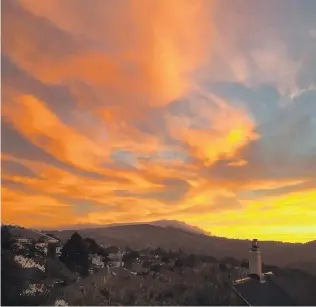  ?? PHOTO: MARTYN FIELDS ?? The last of the WWT cloud photos. A vivid cirrus and altocumulu­s sunrise over Dunedin and Mount Cargill in March this year.