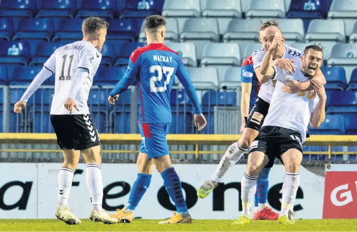  ??  ?? Party time Josh Todd leads the celebratio­ns after bagging the vital equaliser that kept Ayr in the Championsh­ip