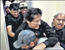 ?? REUTERS ?? A videograb of Khan getting assistance after the attack.