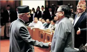  ?? Reuters ?? K P Oli greets Prachanda after announcing his resignatio­n in Parliament on Sunday.