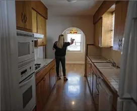  ?? DAVID PAUL MORRIS/BLOOMBERG ?? A Realtor uses a smartphone to do a virtual video tour of a home for sale in June in Sacramento, California. The share of first-time buyers declined last month to 29%, the lowest since 2019, as high asking prices limited affordabil­ity.