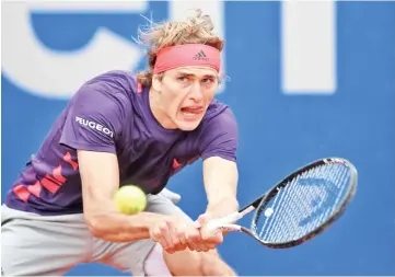  ??  ?? Germany's Alexander Zverev returns the ball to Chile's Christian Garin during their quarter final match at the ATP tennis Open in Munich. — AFP photo