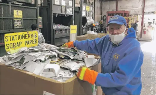  ?? MARK BROWN/SUN-TIMES ?? In his younger days as a recycling volunteer, back when he was in his early 80s, retired banker Don Corydon said he would climb atop this box of scrap paper to stomp it down. Now he lets others do the job.