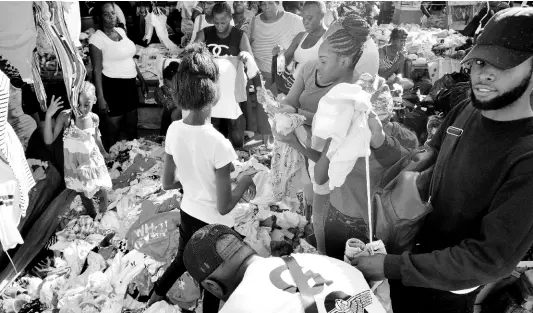  ?? FILE ?? In this 2019 file photo, people are seen in downtown Kingston shopping for Christmas. Amid speculatio­ns of relaxing COVID-19 protocols, there are concerns of spike in the cases should there be easing of anti-COVID-19 measures.