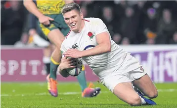  ?? EPA ?? England’s Owen Farrell scores a try against Australia at Twickenham.