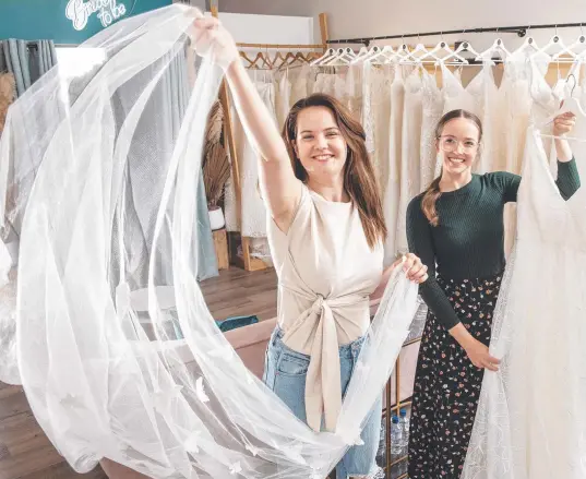  ?? ?? FAMILY BUSINESS: Lizzi Meyer (left) and Kate Meyer are two thirds of Three Sisters Bridal Boutique.
Picture: Nev Madsen.