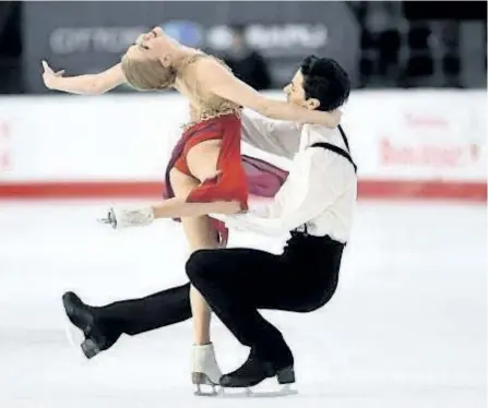  ??  ?? Kaitlyn Weaver and Andrew Poje perform their senior ice dance free dance during the National Skating Championsh­ips in Ottawa in January. Canada’s Weaver and Poje arrived at last year’s world championsh­ips armed with the No. 1 ranking, and two seasons...