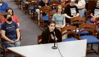  ?? AMHERST REGIONAL SCHOOL COMMITTEE ?? Left, after the article about the middle school was released, student reporter Lucia Lopez spoke at an Amherst Regional School committee meeting.