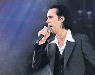  ?? GUS STEWART REDFERNS ?? Nick Cave, seen performing in London, England, this year, is a charmingly charismati­c entertaine­r, Nick Krewen writes.