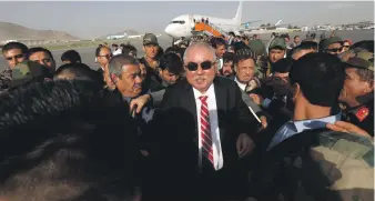  ?? Reuters ?? Afghan Vice President Abdul Rashid Dostum arrives at Hamid Karzai Internatio­nal Airport in Kabul, Afghanista­n, yesterday. A suicide bomb attack at a celebratio­n to mark his return killed 14 people and wounded 50