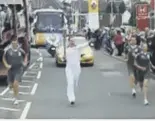  ??  ?? The Scotsman’s chief sports writer Stuart Bathgate had the honour of carrying the Olympic Torch in dumfries yesterday. To view, go to www.london2012.com/ torch-relay/video/live, select 21 June and slide along to 8.28am