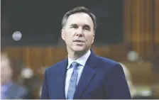  ?? ADRIAN WYLD/THE CANADIAN PRESS ?? Finance Minister Bill Morneau has made a tacit acknowledg­ment that debt is making Canada vulnerable.