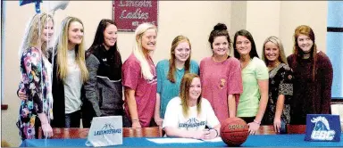  ?? PHOTOS BY MARK HUMPHREY ENTERPRISE-LEADER ?? Lincoln senior Kendra Cummings (seated) signed a national letter of intent to play women’s college basketball for Central Baptist College, of Conway, on Thursday. Her teammates from the 2016-2017 high school girls basketball season joined her for a...