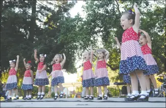  ?? NEWS-SENTINEL PHOTOGRAPH­S BY BEA AHBECK ?? The Tiny Tot Tappers performs during the Celebrate America event at the West Park at Hutchins Street Square in Lodi on Wednesday.