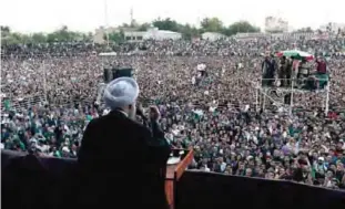  ??  ?? MASHHAD: Iranian President and candidate in the upcoming presidenti­al elections Hassan Rouhani gives an address at a campaign rally in Takhti stadium in this northeaste­rn city yesterday. —AFP