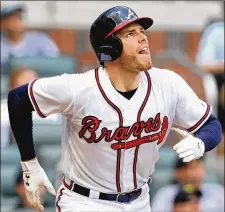  ??  ?? Freddie Freeman, who’s having a strong season for the first-place Braves and is contending for National League MVP, watches his solo home run Wednesday against the Mets. CURTIS COMPTON/ CCOMPTON@ AJC.COM