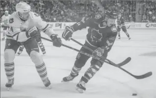  ?? KAZ NOVAK, THE HAMILTON SPECTATOR ?? Marlies Brendan Mikkelson, and Bulldogs Daniel Carr battle for puck control during the Hamilton Bulldogs and Toronto Marlies game at FirstOntar­io Centre. Toronto won 3-1.