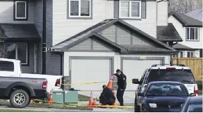 ?? DAVID BLOOM/POSTMEDIA/FILE ?? Edmonton police investigat­e a house in the Rapperswil­l neighbourh­ood on Oct. 7. They found Phu Phan, 30, dead in the driveway with multiple gunshot wounds.